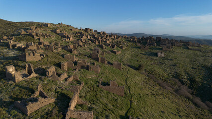 Fototapeta premium Aerial Drone View of Ruined Stone Houses in Abandoned Sazak Village Karaburun