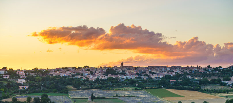 Sunset over hilltop Puimoisson village, Provence France