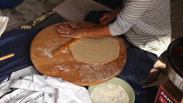 Rolling out the thin yufka dough for Turkish g&ouml;zleme.