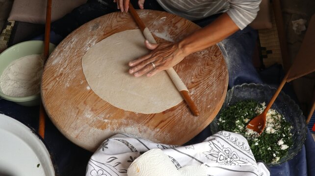 Rolling out the thin yufka dough for Turkish g&ouml;zleme.