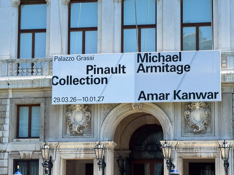 Venice, Italy - May 20, 2026: Palazzo Grassi building facade featuring large banner for Pinault Collection exhibition by Michael Armitage and Amar Kanwar