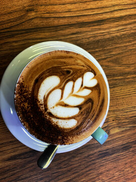 Latte Art Coffee on Wooden Table