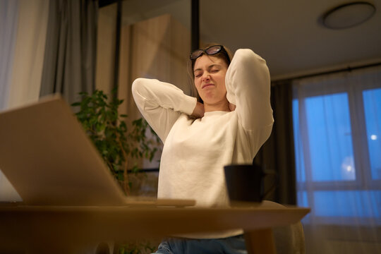 Freelancer stretching during a late remote work break