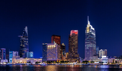 Fototapeta premium Night view of coastline with skyscrapers of Ho chi minh or Saigon city in Vietnam