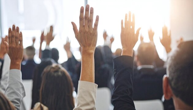 Professional audience raising hands at a seminar, representing active engagement, voting, and collaborative learning. Perfect for business, education, and corporate communication themes.