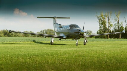 There is a nice propeller plane on the grass of the airport, no people. © Andrzej Płotnikow