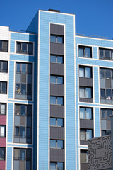 Obraz premium Colorful blue facade of modern apartment building as example of cladding design