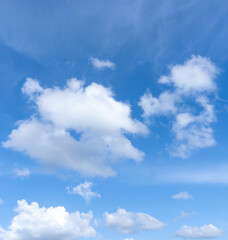 Fototapeta premium Low angle view and full frame of beautiful blue sky with strange shape of fluffy white clouds in the afternoon on sunny day used as natural background texture in decorative art work