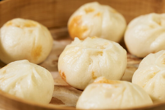 Golden Steamed Buns in Bamboo Steamer