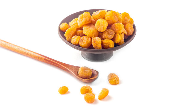 Dried Scallops in Bowl with Wooden Spoon
