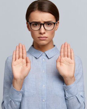 Dejected businesswoman holding hands up while looking disappointed at camera