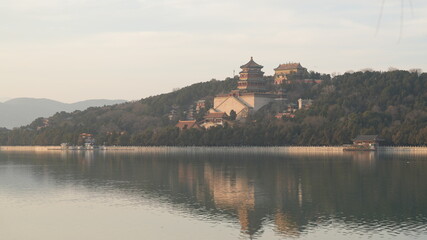 Obraz premium The beautiful sunset view in the Summer palace of Beijing in the winter 
