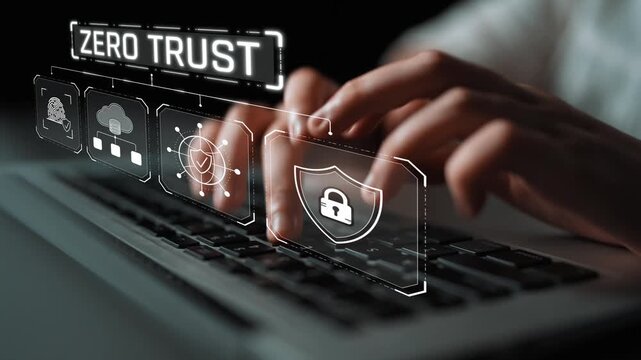 Conceptual representation of zero trust security model with digital overlays illustrating cloud, data protection, and user authentication on a laptop keyboard Sigmoid