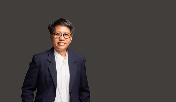 Smiling Female CEO Standing in Studio Portrait