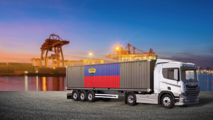 Container Truck at Port: A modern container truck, adorned with the flag of Liechtenstein, stands ready for transport at a bustling port under a twilight sky, with cranes in the background © bao