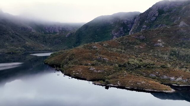 Low Dove lake aerial hovering at sunrise in view of Cradle Mountain &ndash; the overland walking track.