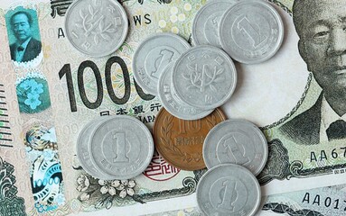 Japanese yen money bills and coins on table. Japan cash of JPY currency close up © Larysa