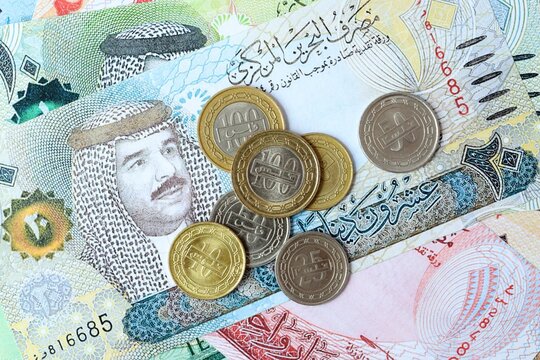 Bahraini dinar money bills and coins on table. Bahrain cash of BHD currency close up