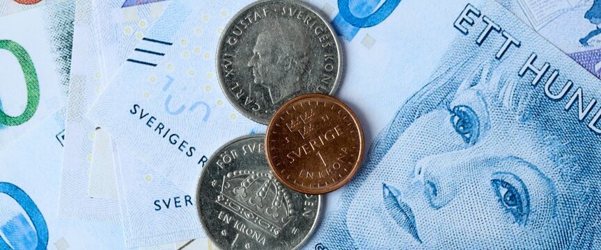 Swedish krona money bills and coins on table. Sweden cash of SEK currency close up