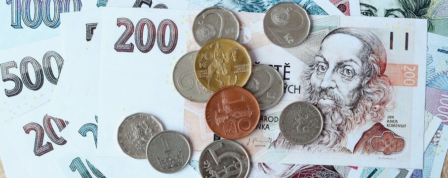 Czech koruna money bills and coins on table. Czech Republic cash of CZK currency close up