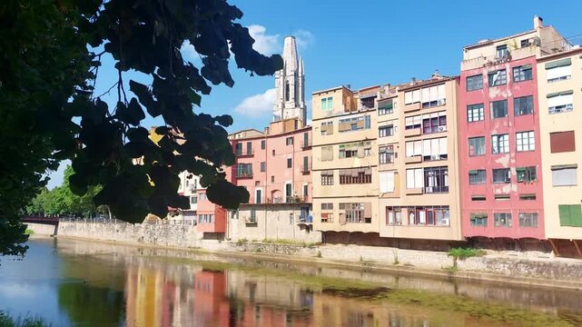 Colorful houses reflecting on Onyar river in Girona, Spain