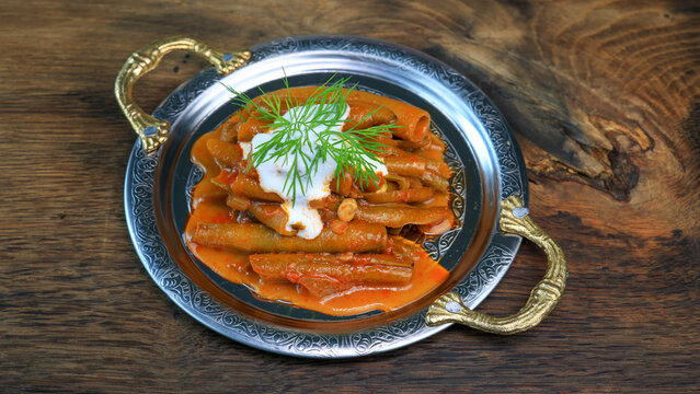 Bakla Broad bean dish with olive oil on wooden board
