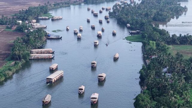 Aerial drone view of traditional houseboats on Kerala backwaters, Alappuzha, India.
