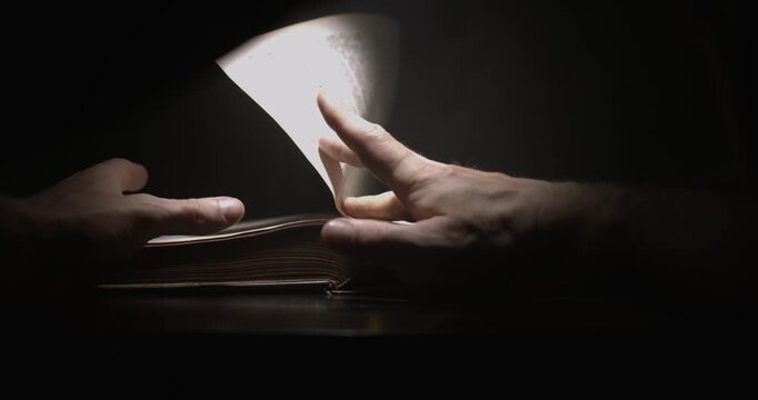 Super Slow Motion Deliberately Exploring Wellworn Leatherbound Aged Books Beneath Soothing Ambient Light