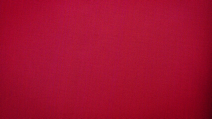 Fototapeta premium Bright red textile fabric showing smooth texture and even color in a close view with no patterns or designs visible