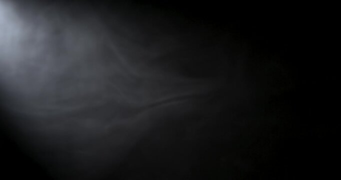 Misty Smoke On Black Backdrop. Shrouded Smoke Tendrils With Soft Backlight Creating Mysterious Atmosphere