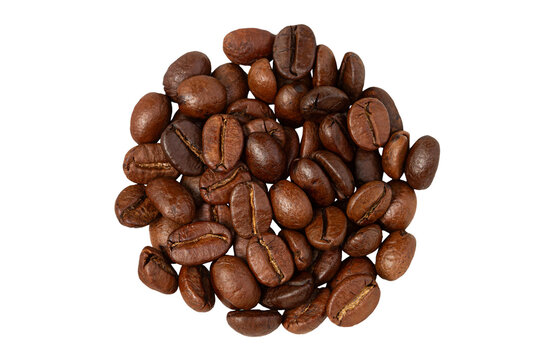 A pile of roasted coffee beans on a white background, top view, close-up.