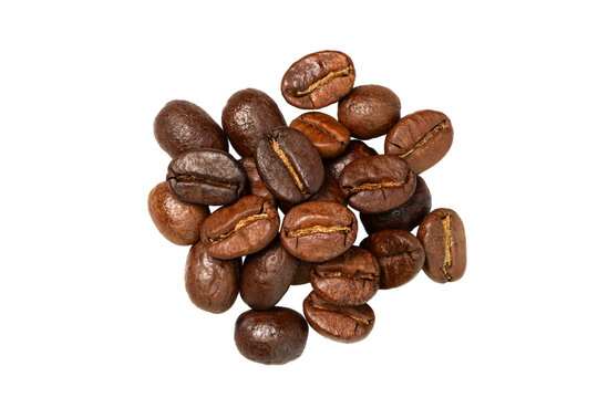 Roasted coffee beans piled on a white background, top view.