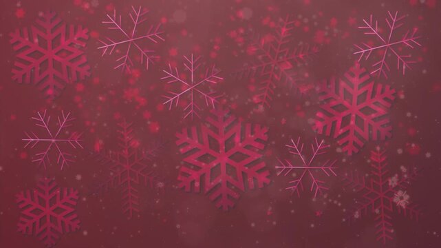 Beautiful winter background featuring red and pink snowflakes on a soft bokeh backdrop, perfect for Christmas or winter holiday design.