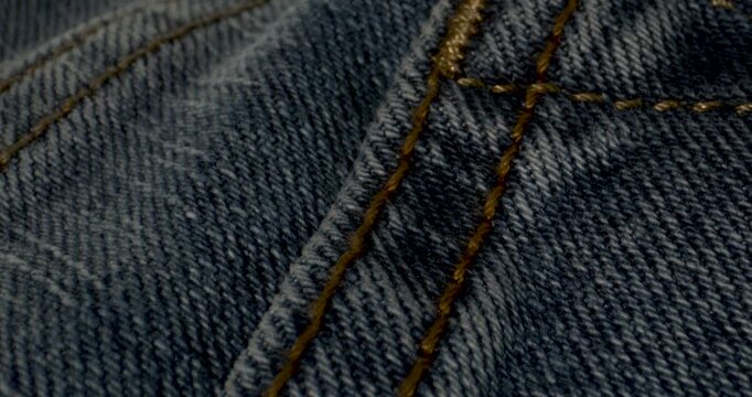 Vintage Denim Craftsmanship. Closeup Of Aged Denim Showcasing Handcrafted Sewing And Nostalgic Charm