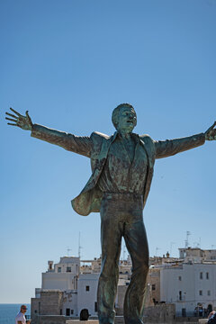 staue of the famous apulian singer Domenico Modugno in Polignano a Mare in Apulia