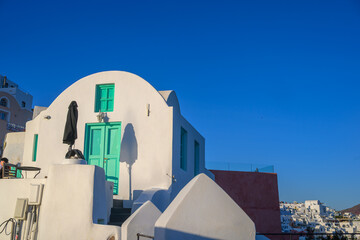 Obraz premium Cycladic house with green shutters in Oia