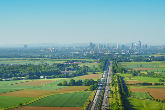 A landscape from a drone perspective, with a view of the highway leading to Frankfurt am Main.. An agricultural landscape from the air.