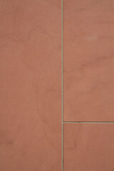 Fototapeta premium Red Stone Wall with Minimalist Architectural Lines