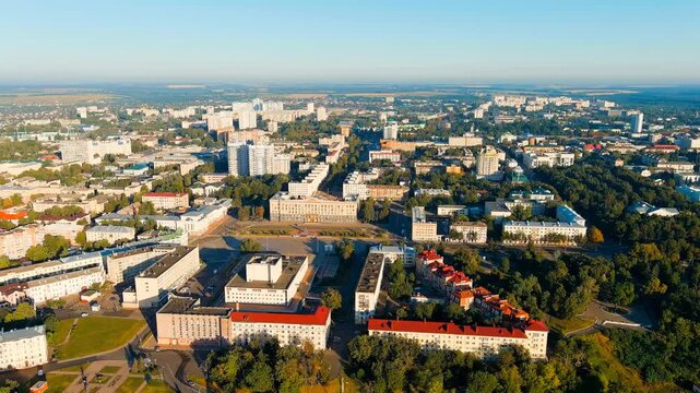 Oryol, Russia. The House of Soviets on Lenin Square, a monumental Soviet-era administrative complex with a long horizontal facade, Drone footage over the Orlik River embankment and city center. Drone