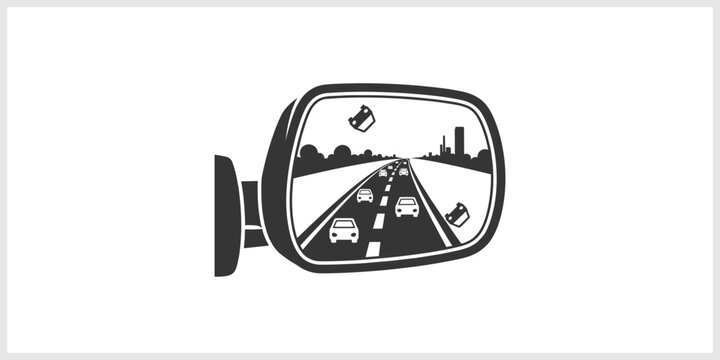 Side Mirror Reflection of Highway Traffic and City Skyline