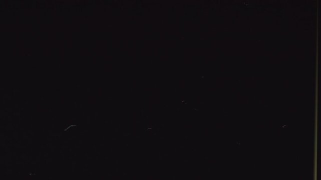 Super 8 Vintage Film Dust Overlay with Subtle Scratches on Black Background
