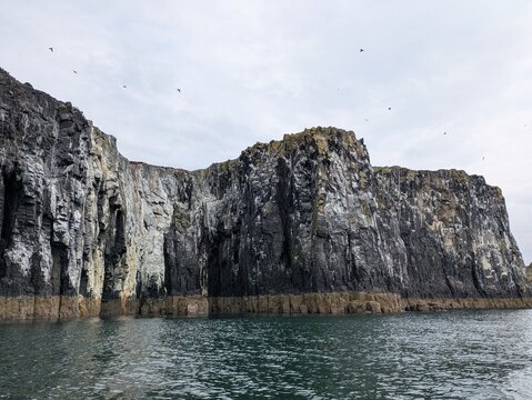 Stunning view of rugged cliffs in Scotland, showcasing the unique geology and natural beauty of the coastline, ideal for environmental themes and travel inspiration.