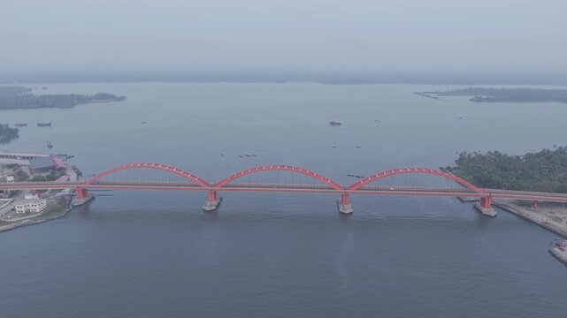 Aerial drone view of Thanneermukkom Bund, bridge located in Alappuzha and Kottayam Kerala, India 

