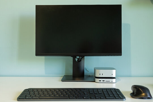 Modern desktop computer setup with monitor, keyboard and ergonomic mouse