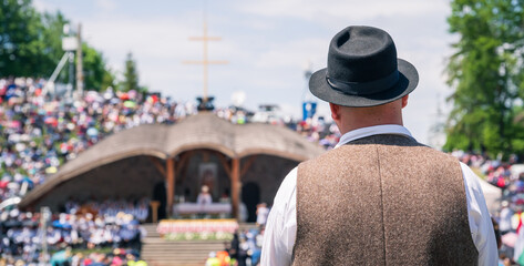 Fototapeta premium Looking out to the crowded pilgrimage site at Csiksomlyo hill on Pentecost saturday