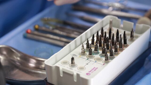 Selecting Drill Bits With Careful Fingertip Control In Sterile Environment During Implant Surgery