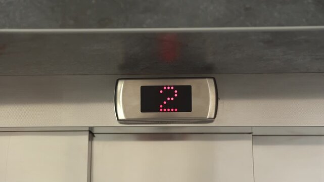 Elevator Panel Display. Industrial Styled Lobby Showcases Glowing Elevator Panel With Animated Numbers