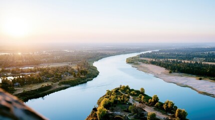 Obraz premium A stunning aerial view capturing the meandering river surrounded by lush green trees and serene nature, showcasing the beauty and tranquility of the natural landscape.