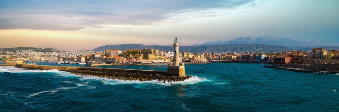 Greece Crete Chania old venetian port panorama 17K lighthouse golden hour waves crashing pastel houses high resolution World Print fine art coastal landscape harbor, iconic  greek landmarks