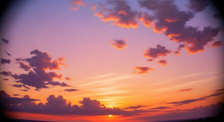 Fototapeta premium Breathtaking sunset sky with vibrant orange and purple clouds, capturing the beauty of the horizon as the sun dips below the line